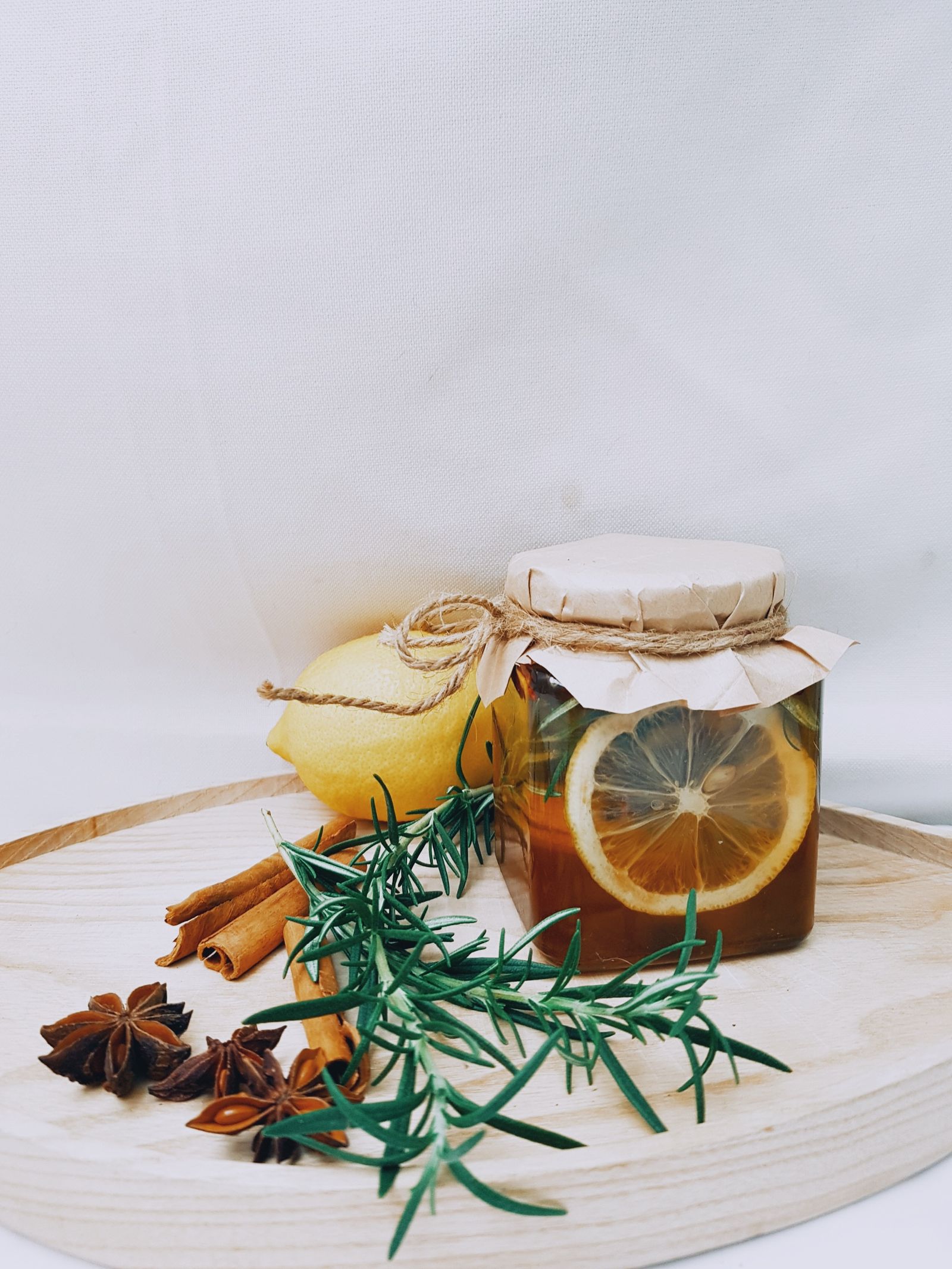 Free A close-up of ingredients for herbal tea, featuring bowls of spices and a jar of honey.